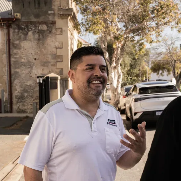 Leo talking a homeowner through the work at their front door