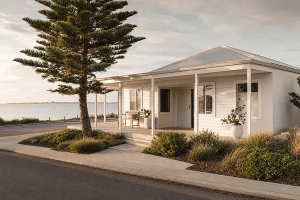 Weatherboard beach home under a Norfolk pine across from the Safety Bay foreshore