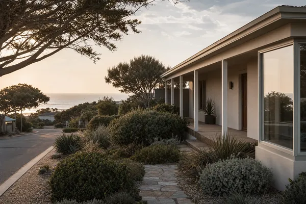 Single-storey coastal home among native gardens on a quiet San Remo street, the ocean beyond