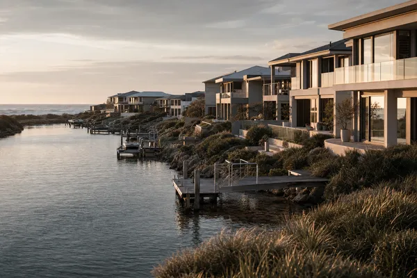 Canal-estate homes and boat pens along the waterway at Wannanup